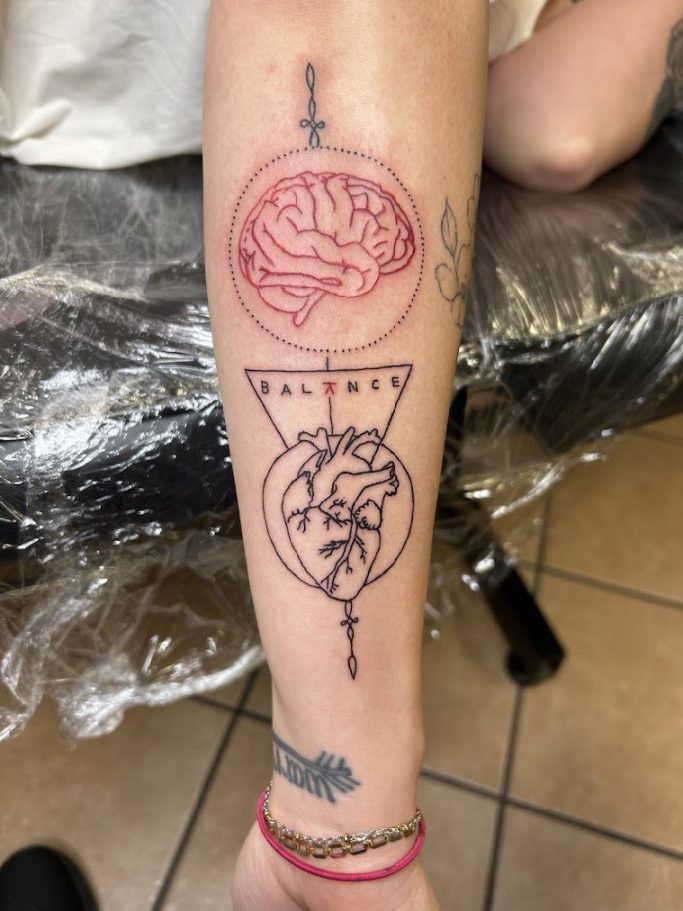 Heart and Brain Balance Tattoo Fine line tattoo showing balance between heart and mind done by Mark's Art LLC in Rapid City, SD.